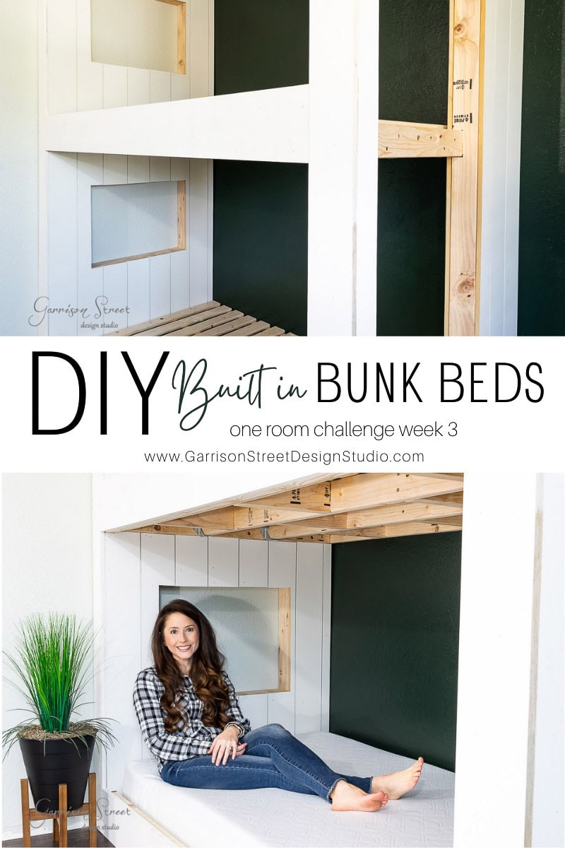A woman smiles while seated on a white bunk bed. The top half of the image reveals a DIY built-in bunk bed crafted from unfinished wood with white panels, set against a dark green wall. A potted plant adds life near the cozy nook. Text reads "DIY Built-in Bunk Beds."