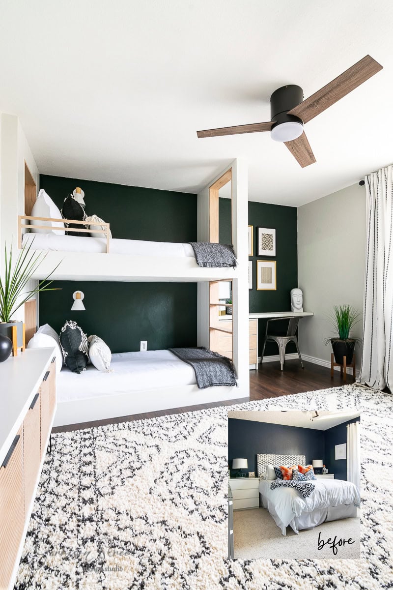 A modern bunk room with dark green walls features a bunk bed with white bedding, a wooden desk adorned with decorations, a large patterned rug, and a ceiling fan. An inset image shows the room's previous setup before remodeling, highlighting its transformation from a large bed to this cozy layout.