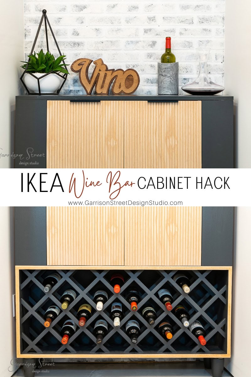 A modern wine bar cabinet boasts a rack brimming with diverse bottles and a chic wooden "Vino" sign on top. Decorative items enhance its charm. Text overlay declares, "IKEA Wine Bar Cabinet Hack" with an accompanying website link for this creative transformation.