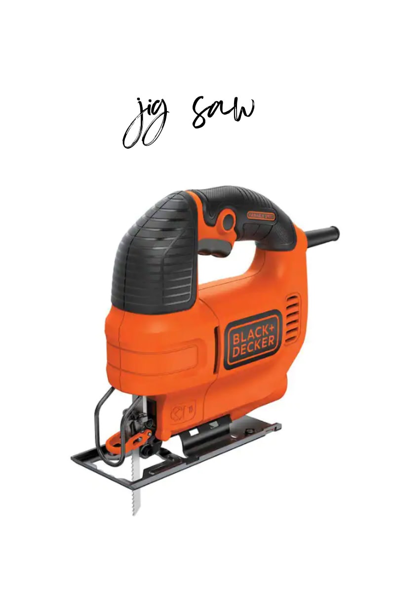 An orange and black Black & Decker jigsaw is displayed on a white background. The words "jig saw" are elegantly scripted above in cursive.
