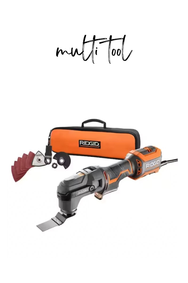 The Ridgid multi-tool kit, which features an oscillating power tool and various attachments. It comes with a convenient orange carrying case for easy transport and storage.