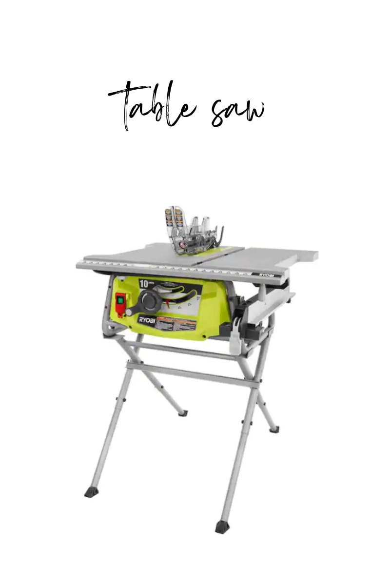A green and silver table saw with a robust blade sitting atop, supported by a metal stand, with "Table Saw" elegantly scripted on a plain white background.