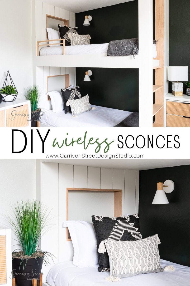 A modern bedroom with bunk beds featuring white and dark green accent walls. Beds are styled with patterned pillows, while a decorative plant sits on a bedside table. The image text reads "DIY Wireless Wall Sconce" from Garrison Street Design Studio, highlighting chic lighting solutions.
