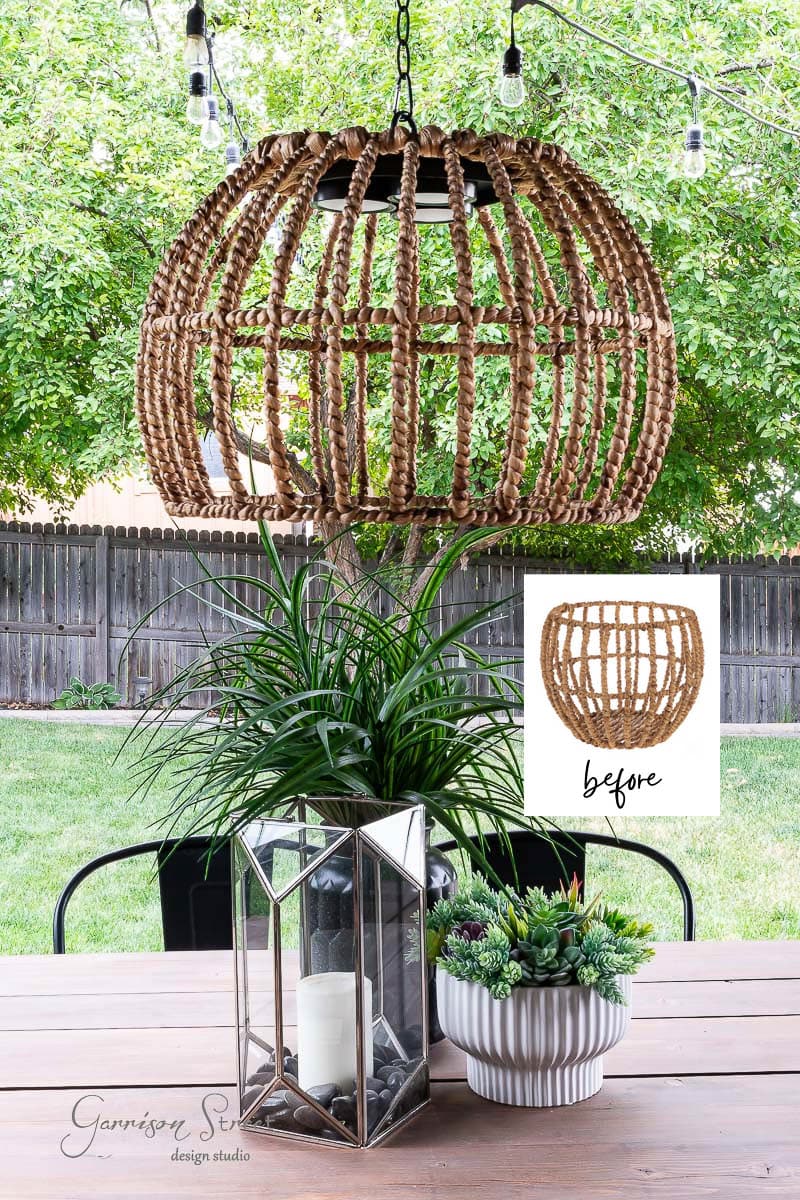 A rustic outdoor table setting features a natural fiber pendant light hanging overhead like a chic chandelier. The table holds a geometric terrarium with a candle and a white pot of succulents. A fenced garden with a tree stands in the background, hinting at DIY charm seen in the light fixture "before.