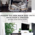 A stylish interior features a modern dog crate beside a dresser, showcasing a creative DIY design. The crate is covered with a patterned vinyl tile and a cozy spotted pillow, with a lush green plant nearby and a mounted TV above a white dresser.