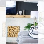 A modern living room features a painted white brick fireplace with stacked decorative logs, a wooden mantel with vases, a TV above, and a gray sofa with striped pillows. Text reads: “DIY 1970s Brick Fireplace Makeover Before and After.”.