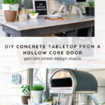 Outdoor countertop with a small pizza oven, plants, and decor; the surface is a DIY concrete tabletop made from a hollow core door, as described in the text overlay.