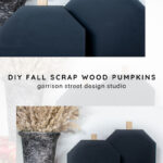 Two black, geometric wooden pumpkins with rectangular stems are displayed next to a textured vase filled with dried grasses and a red patterned cloth, styled for a fall decor setup. Text reads: "DIY Fall Scrap Wood Pumpkins.