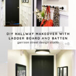 A modern hallway with white ladder board and batten walls, black doors, framed art, a hanging purse and scarf, and updated lighting, showcasing a DIY hallway makeover by Garrison Street Design Studio.