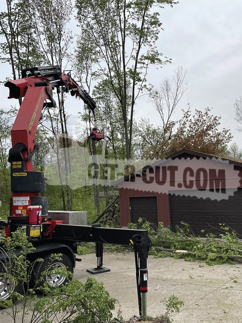 Tree trimming with crane and bucket lift at Get-R-Cut.com.