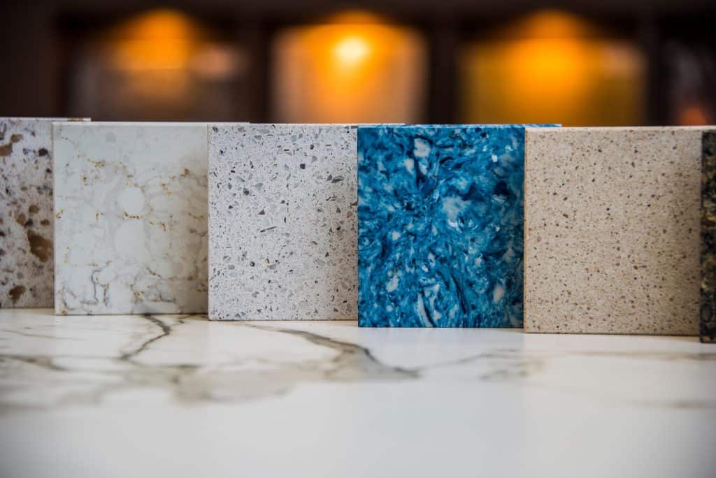 Various natural stone countertop samples in different colors and textures.