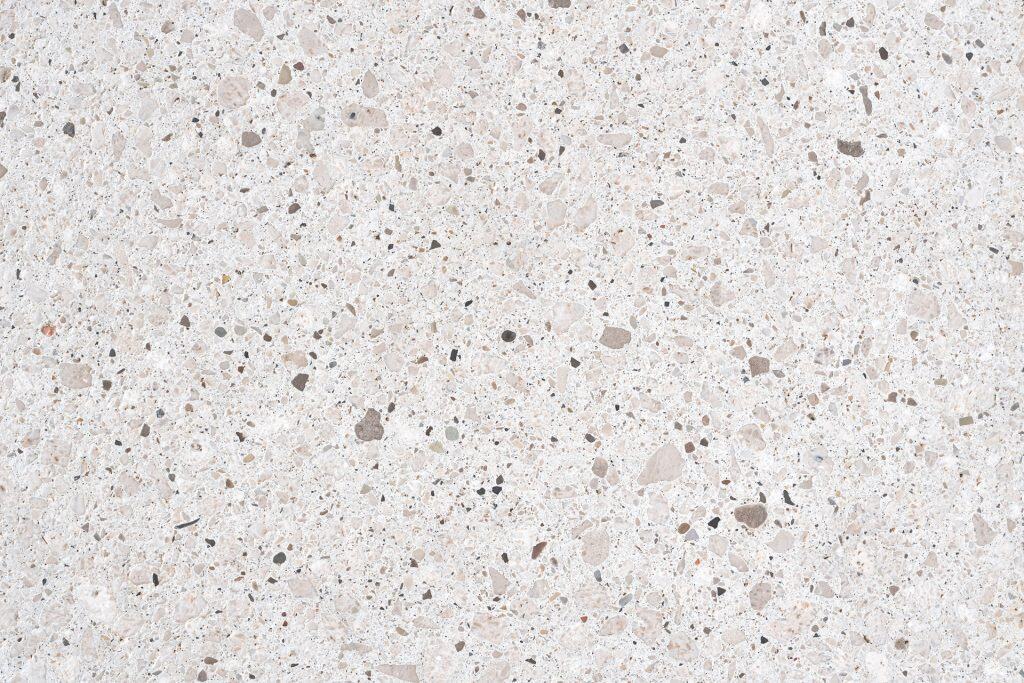 Elegant quartz countertop with speckled beige and gray pattern.