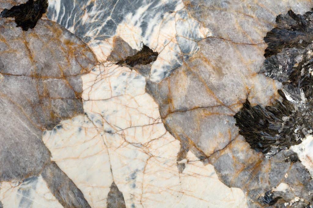 Marble countertop with elegant natural veins, ideal for luxurious kitchen and bathroom surfaces.