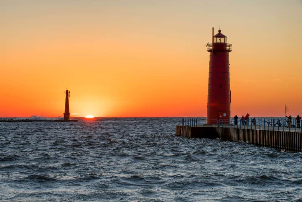 Lighthouse along the coast during sunset, highlighting service area for countertop installation.