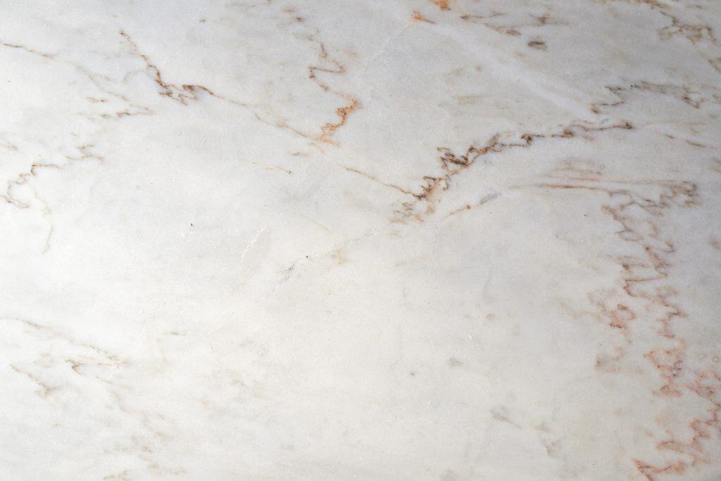 White marble countertop with subtle veining for luxurious kitchen design.
