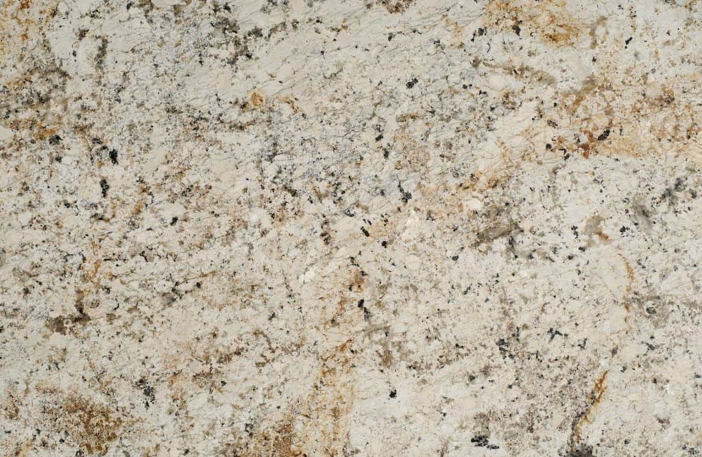 Granite countertop with natural beige, brown, and black speckled pattern.