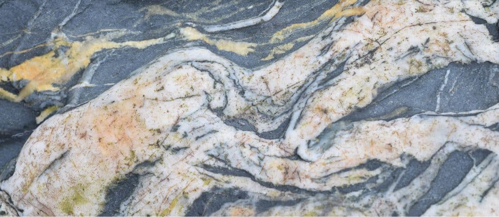 Marble countertop with natural veining and polished finish for luxurious kitchen and bathroom design.