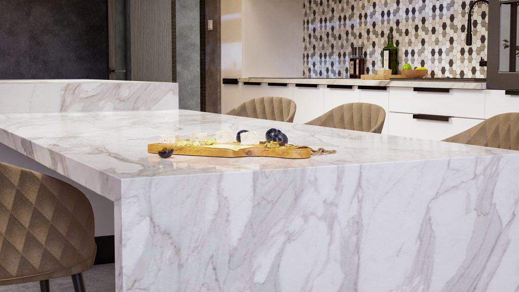 White marble kitchen island with polished surface and subtle veining.
