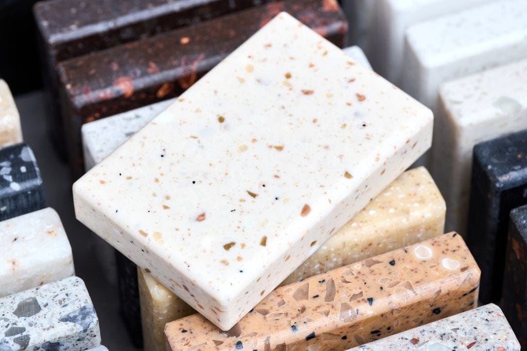 Countertop samples with various stone textures and colors.