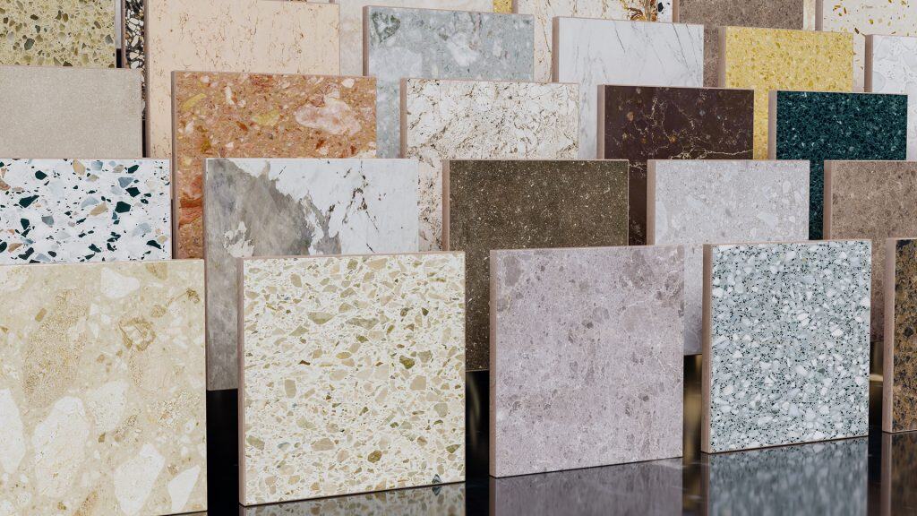 Countertop material samples in various colors and finishes for kitchen and bathroom remodeling.