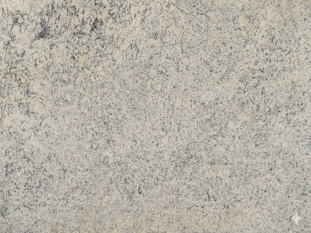 Dallas White granite surface with white and gray speckles for kitchen countertops.