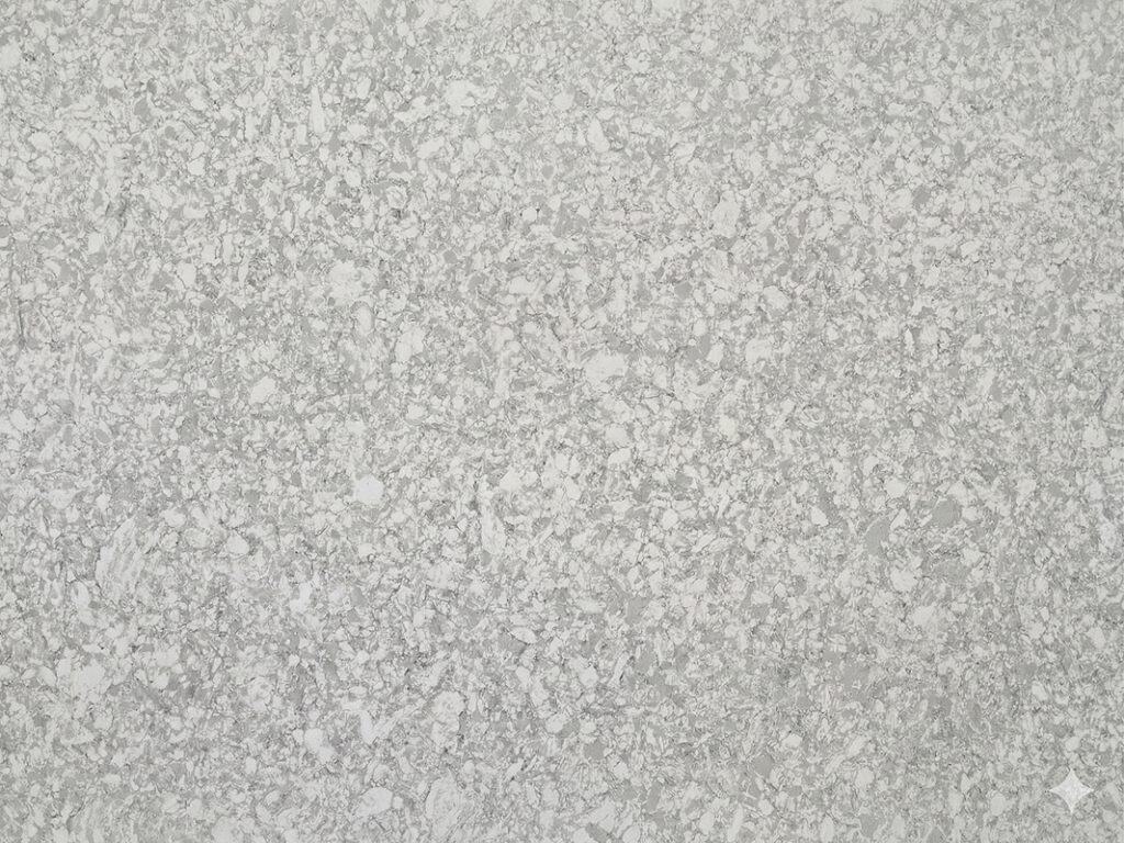 Quartz countertop with a textured, light gray finish.