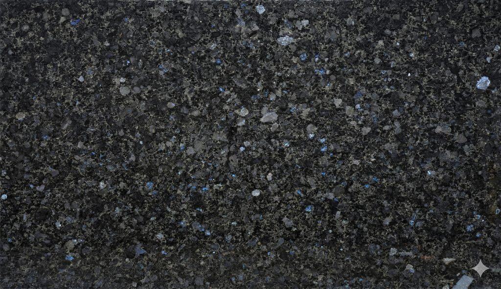 Close-up of Volga-Blue granite with deep blue and black speckles.