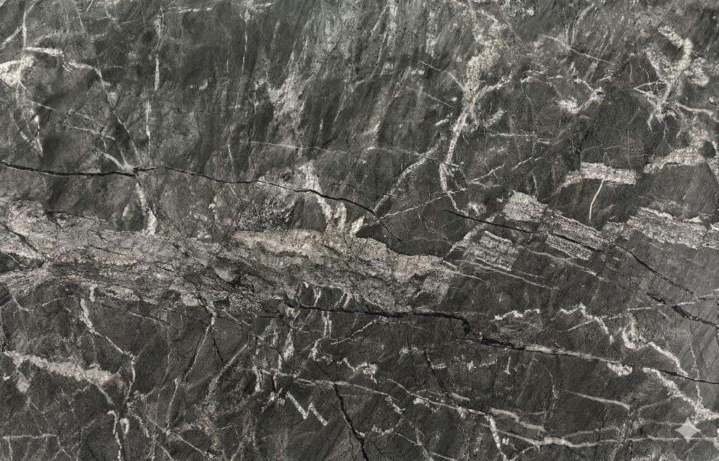 Dark gray marble countertop with white veining, ideal for luxurious kitchen and bathroom designs.