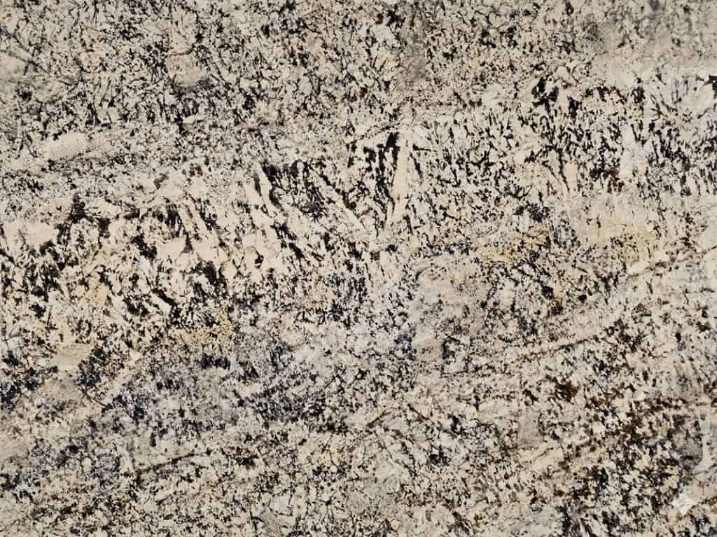 White Persa granite surface with black and gray veining.