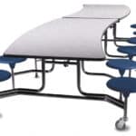 Adjustable-height office table with blue stools and wheels.