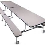 Modern cafeteria table with attached benches and wheels for mobility.