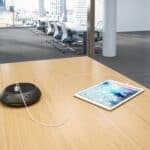 Conference room with tablet and charging station at Grand River Office.
