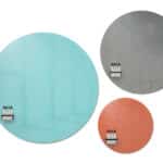 Three circular glassboards in blue, gray, and red with markers.