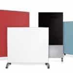 Colorful mobile glass boards on wheels for office or classroom use.