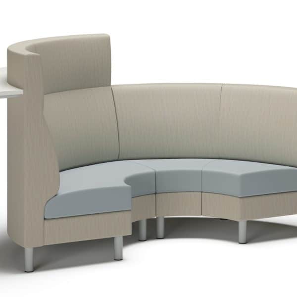 Contemporary curved office seating with a built-in side table.