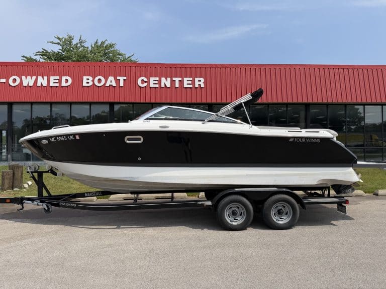 Boat for sale at Hall's Sport Center, featuring a sleek black and white design.