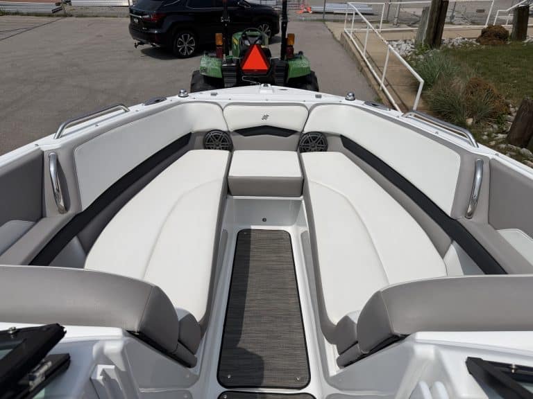 Luxury boat interior with white seating and modern design at Hall's Sport Center.