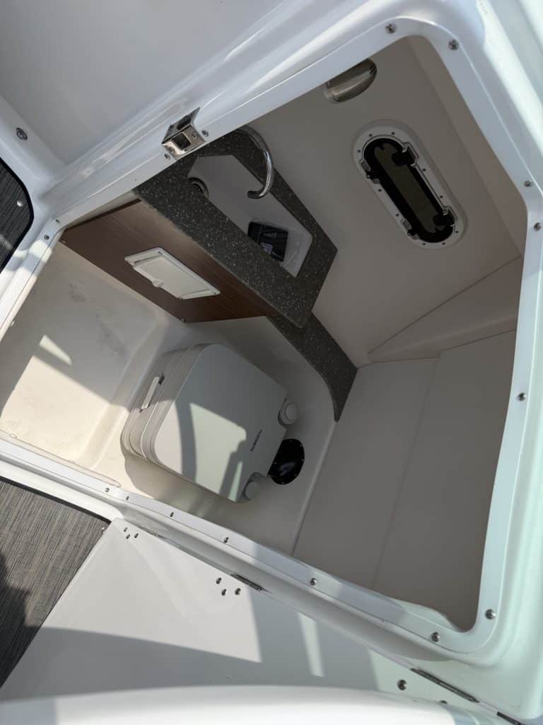 Boat console interior with navigation and control equipment.