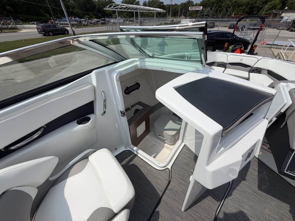 Modern boat interior with helm station and seating at Hall's Sport Center.