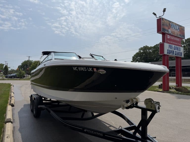 Boat at Hall's Sport Center, outdoor display, on trailer.