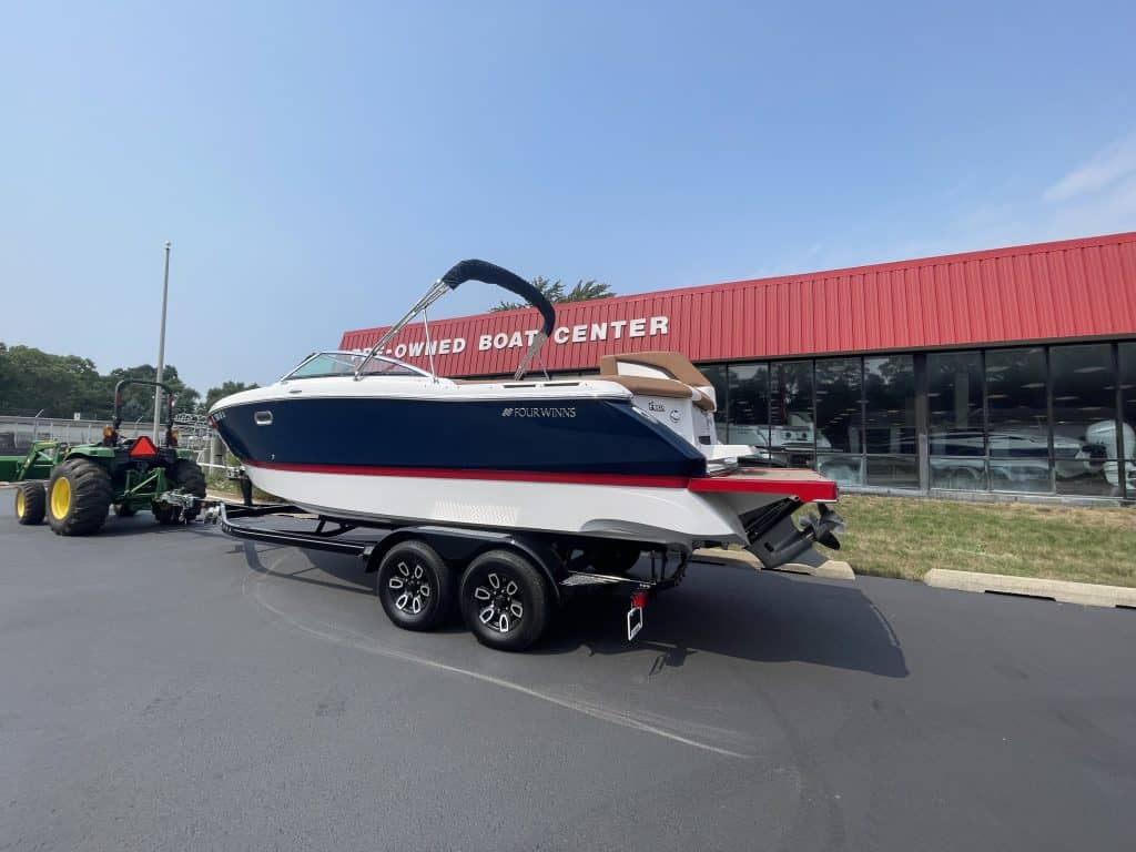Four Winns H260 boat on trailer at Hall's Sport Center.