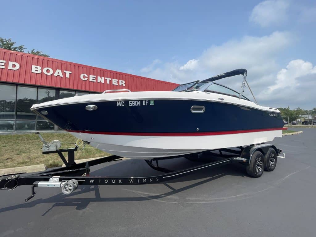 Luxury 2018 Four Winns H260 boat on trailer at Hall's Sport Center.