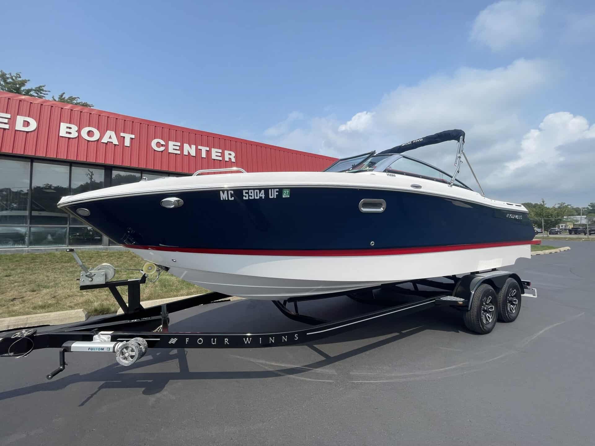 Luxury 2018 Four Winns H260 boat on trailer at Hall's Sport Center.