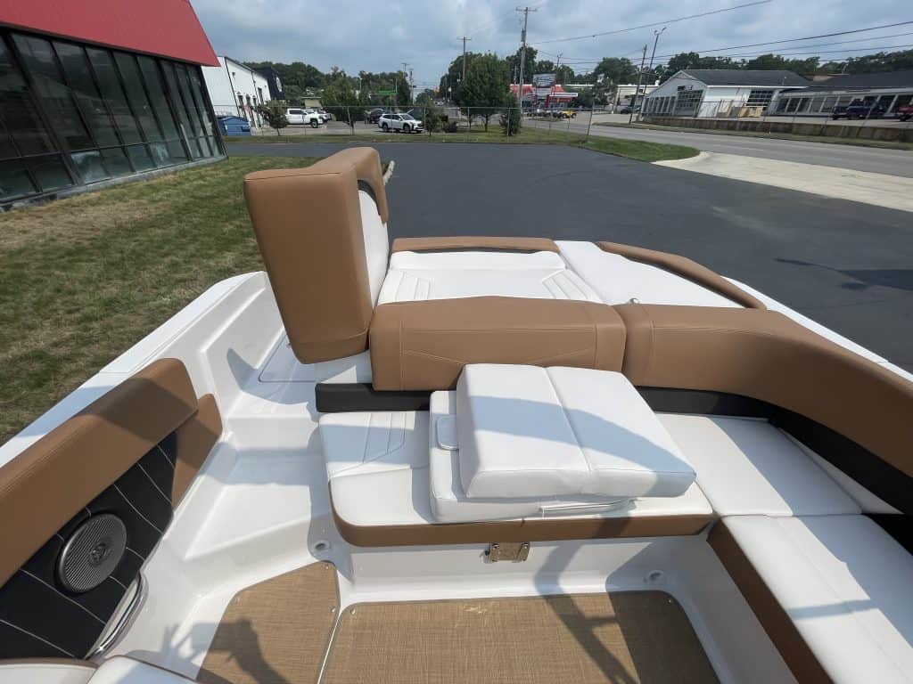 Close-up of the interior seating and deck of a 2018 Four Winns H260 boat.