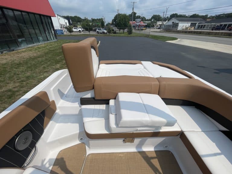 Close-up of the interior seating and deck of a 2018 Four Winns H260 boat.