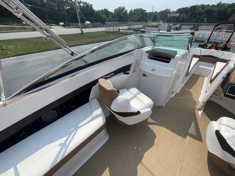Luxury boat interior with seating and dashboard at Hall's Sport Center.