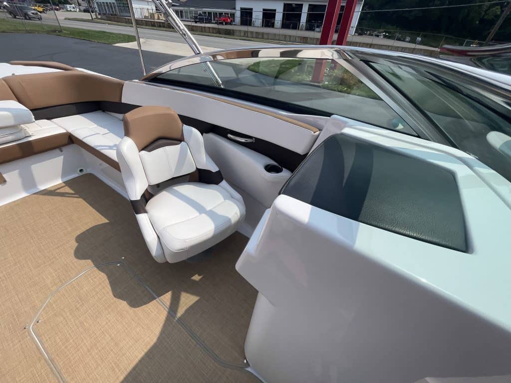 Luxury boat interior with seating and dashboard in 2018 Four Winns H260.