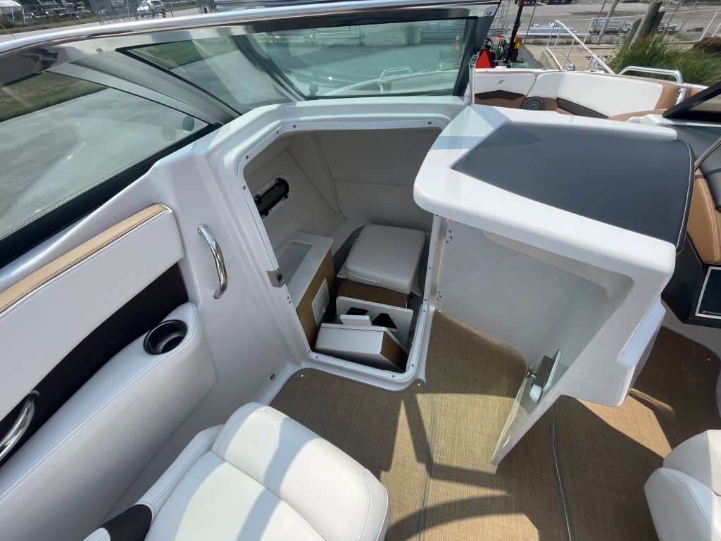 Close-up of the helm and seating area of a 2018 Four Winns H260 boat.