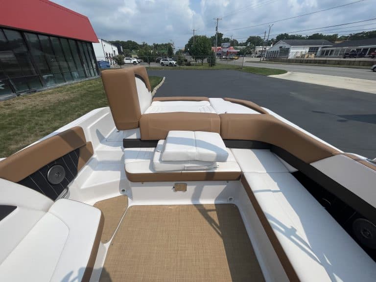 Luxury boat interior with brown and white seating for Four Winns H260.