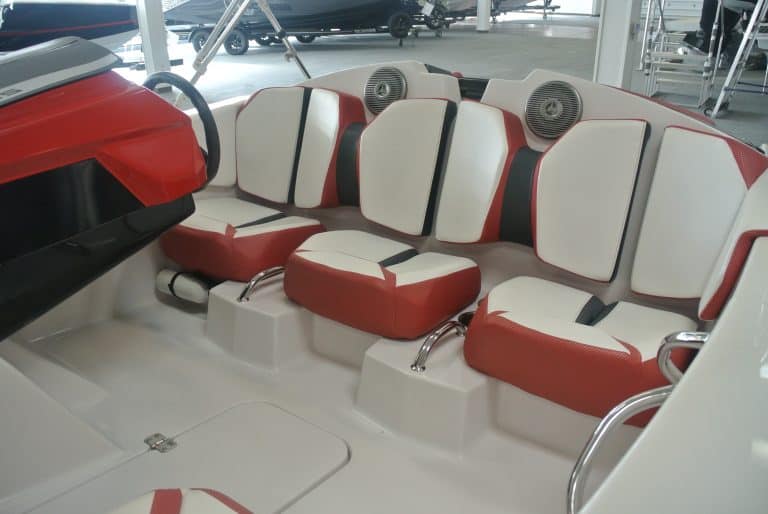 Boat seating with white and red upholstery, ideal for marine adventures.